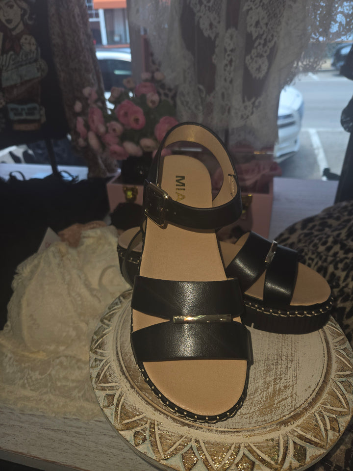 Wide strap Black sandals.