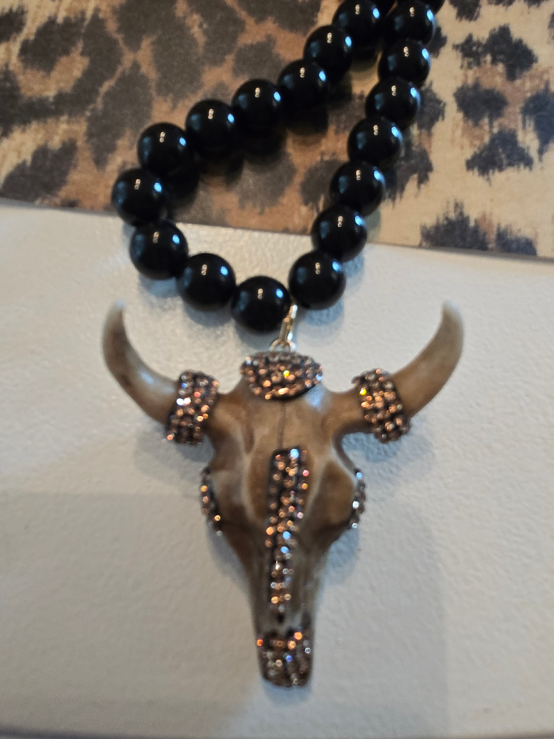 Long Black beaded necklace with gold charm