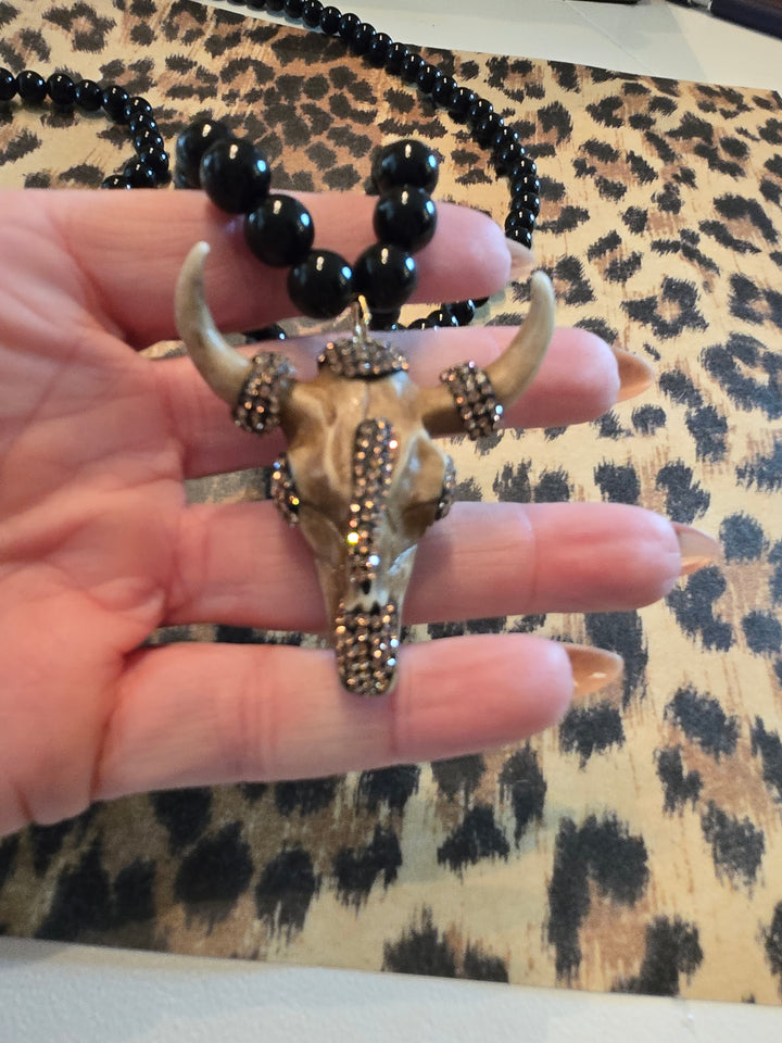 Long Black beaded necklace with gold charm